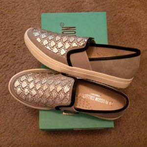 Grey/black foiled slip ons
